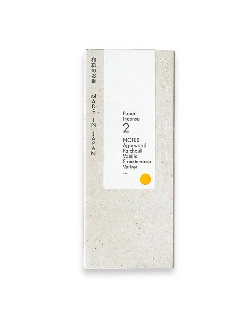 1 of 4.  Box of paper incense with text, orange circle on a white background