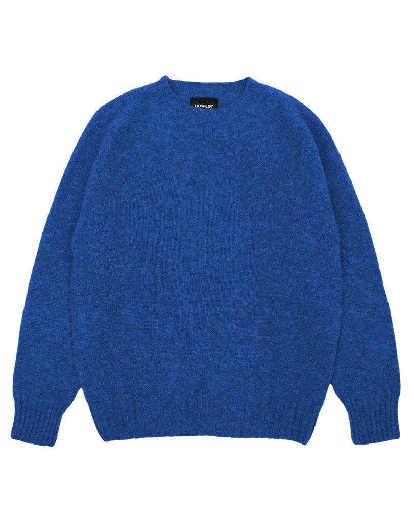 Photo 1 of 2.  Blue wool sweater on a white background with black brand logo.