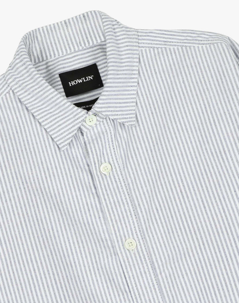 Howlin' Afterthought shirt close-up in blue and white striped brush cotton with white buttons and classic collar.  Howlin' black label in the interior.  Slide 2 of 3