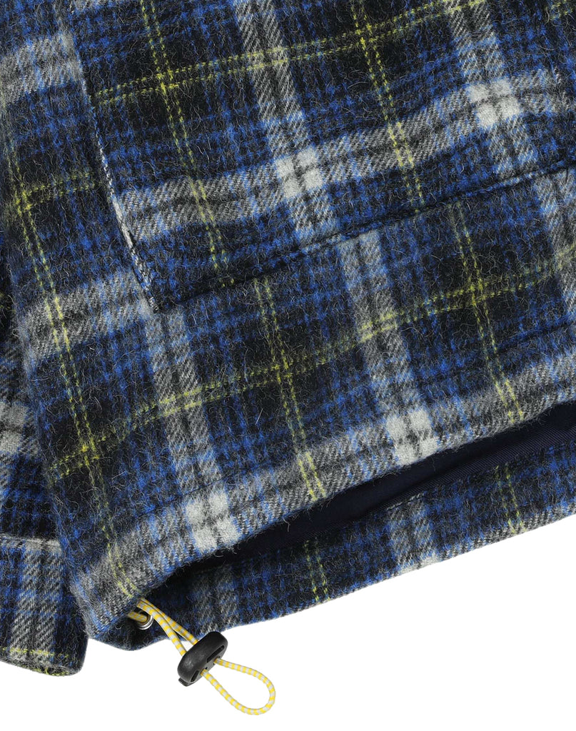 Howlin' Boxy Freedom shirt close-up shot of blue, yellow and white plaid fabric with one yellow adjustable tab.  Slide 5 of 5