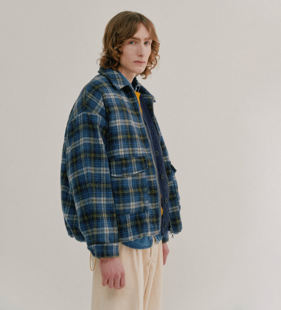 Model is wearing a Boxy swing jacket  by Howlin' with blue green white yellow plaid pattern.  Slide 1 of 2