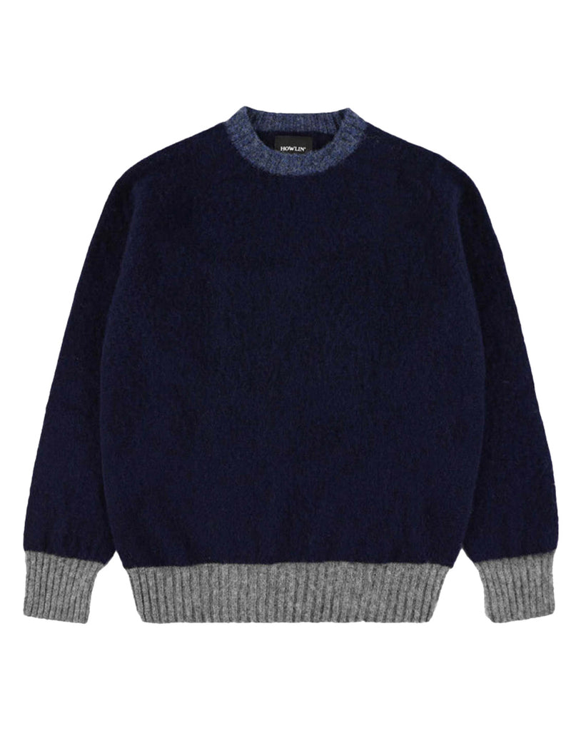 Photo 1 of 3.  Navy wool sweater with gray trim on cuff and hem, light blue on collar on a white background