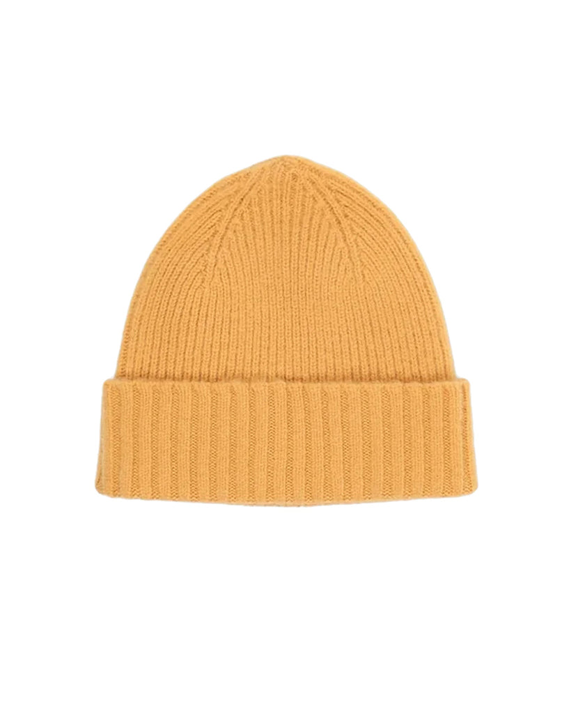 Yellow knit wool beanie on a white background