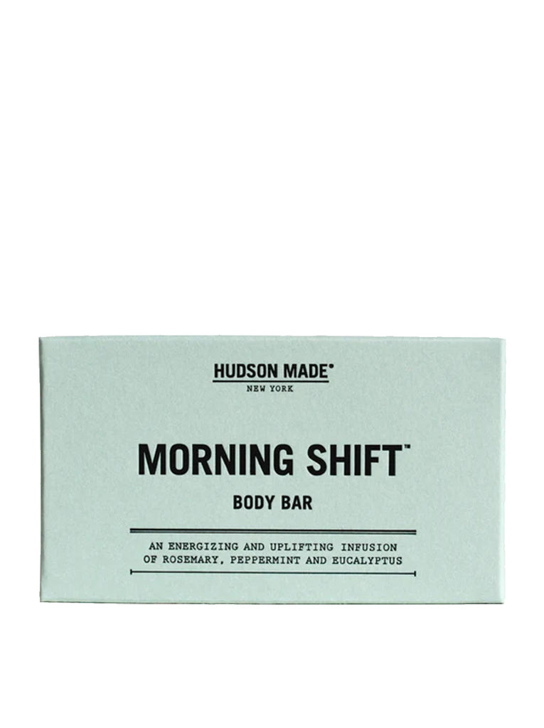 Teal colored box with black embossed text of "Hudson Made" with the name of the scent "Morning Shift" body bar.

Copy reads "An energizing and uplifting infusion of rosemary, peppermint and eucalyptus". slide 1 of 4