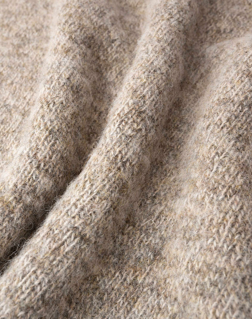 Photo 2 of 2 showing close-up wool material in mushroom