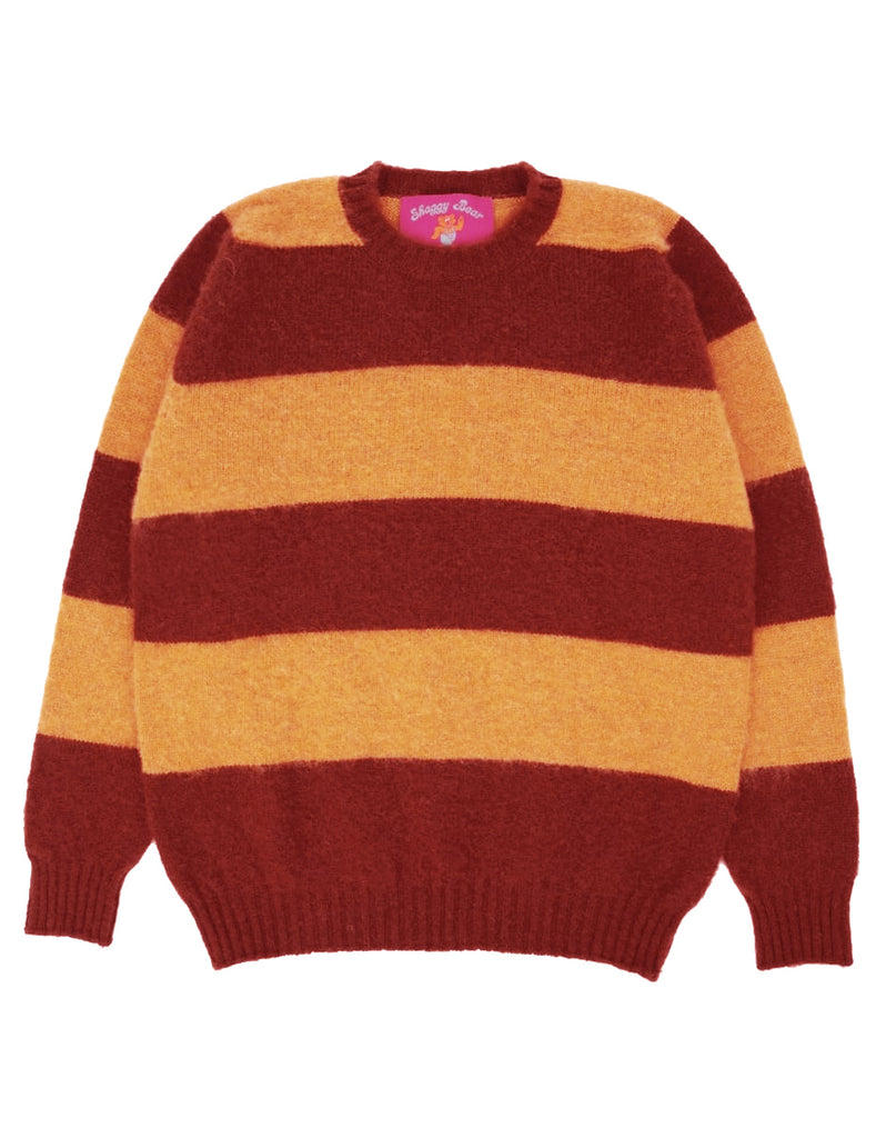 Photo 1 of 2.  Striped wool sweater with red and yellow horizontal stripes on a white background with a pink brand label "Shaggy Bear"