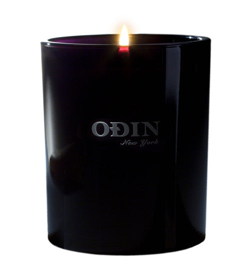 01 Sunda fullsize candle lit with Odin New York printed on the outside of the black vessel.