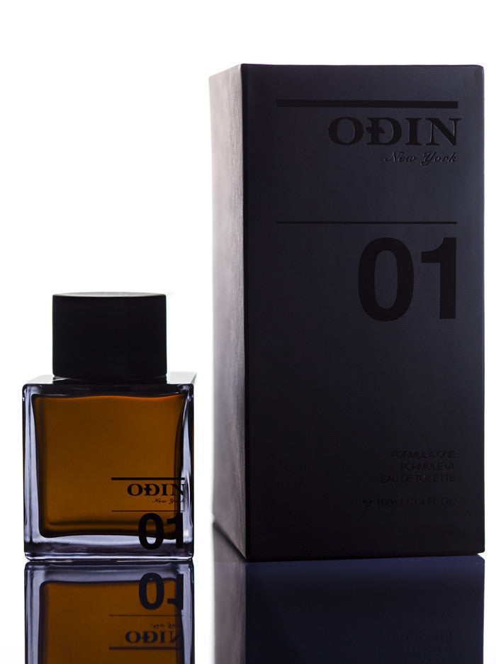 01 Sunda Edp photograph shows the black capped glass bottle with fragrance and black box 