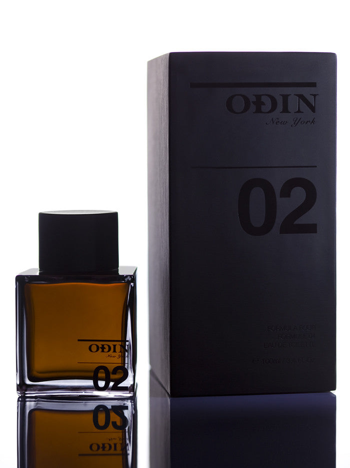 02 Owari Edp photograph shows the black capped glass bottle with fragrance and black box.