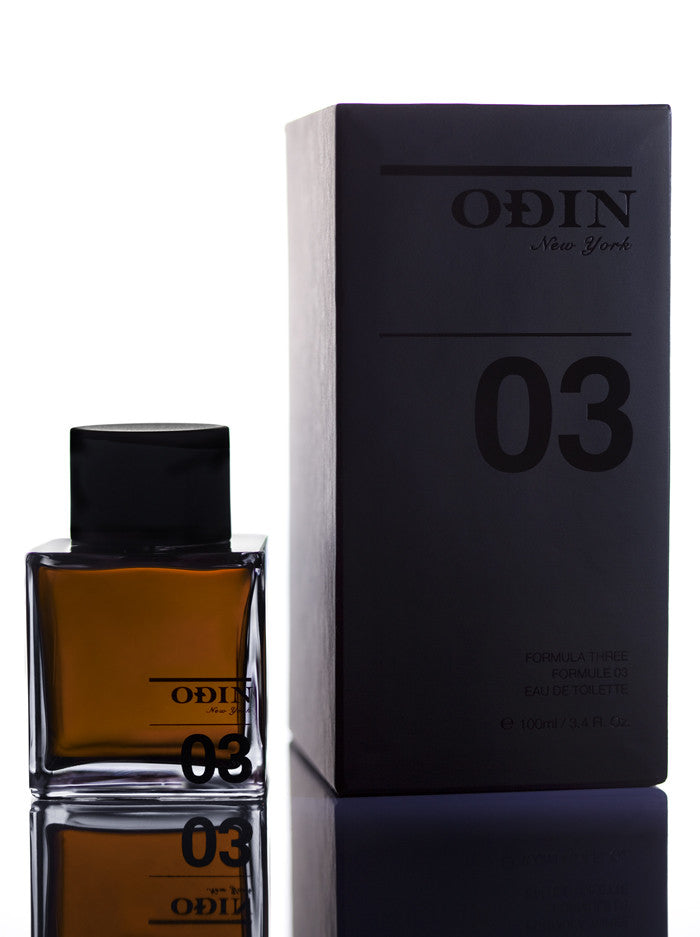 03 Century Edp photograph shows the black capped glass bottle with fragrance and black box 