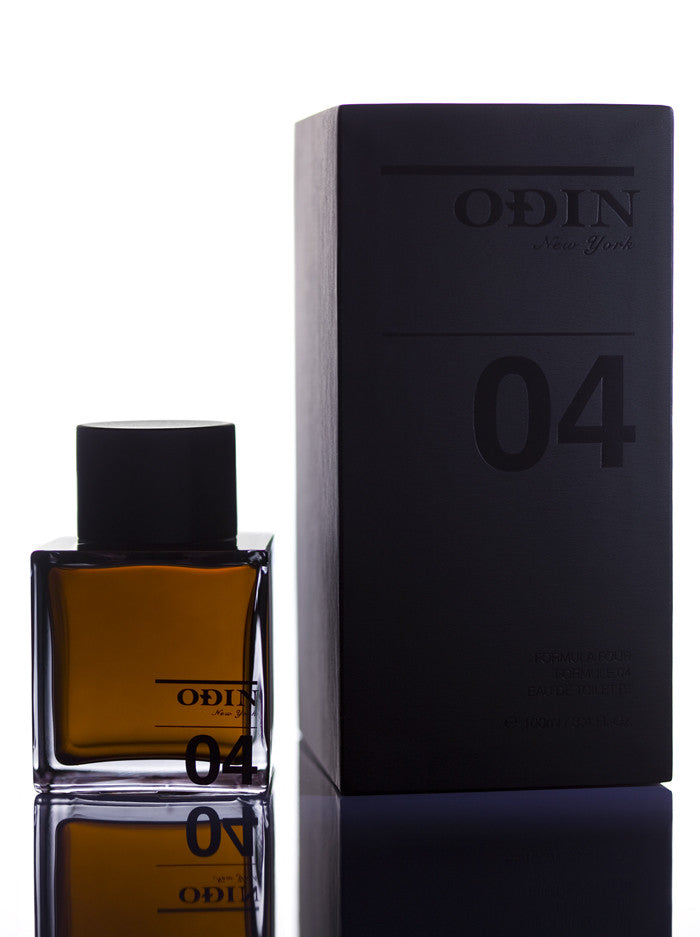 04 Petrana Edp photograph shows the black capped glass bottle with fragrance and black box 