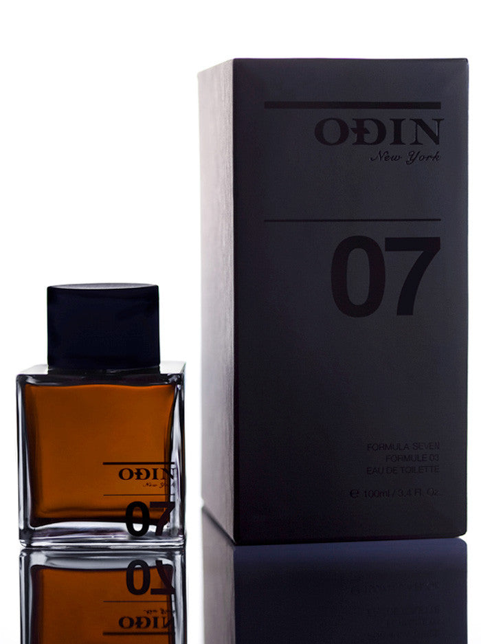 07 TANOKE Edp photograph shows the black capped glass bottle with fragrance and black box 