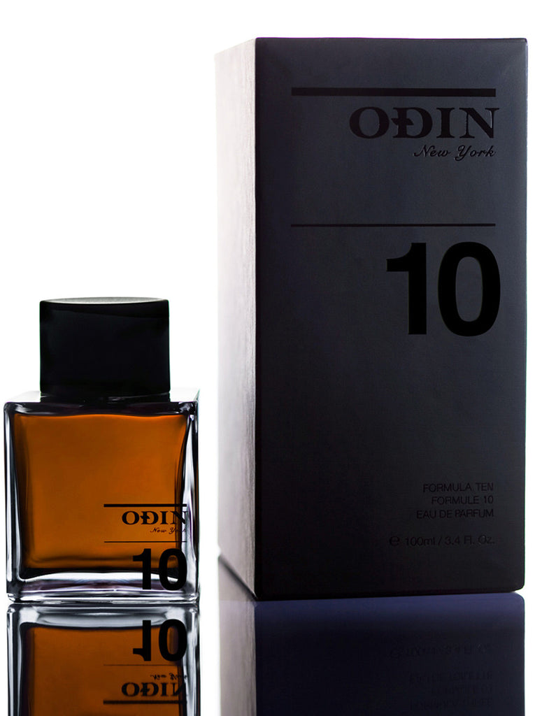 10 ROAM Edp photograph shows the black capped glass bottle with fragrance and black box 